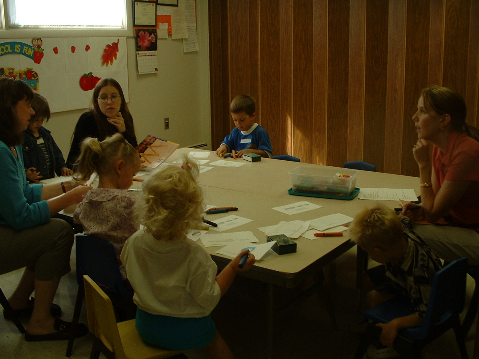 Students are hard at work assembling their "Worship Books"